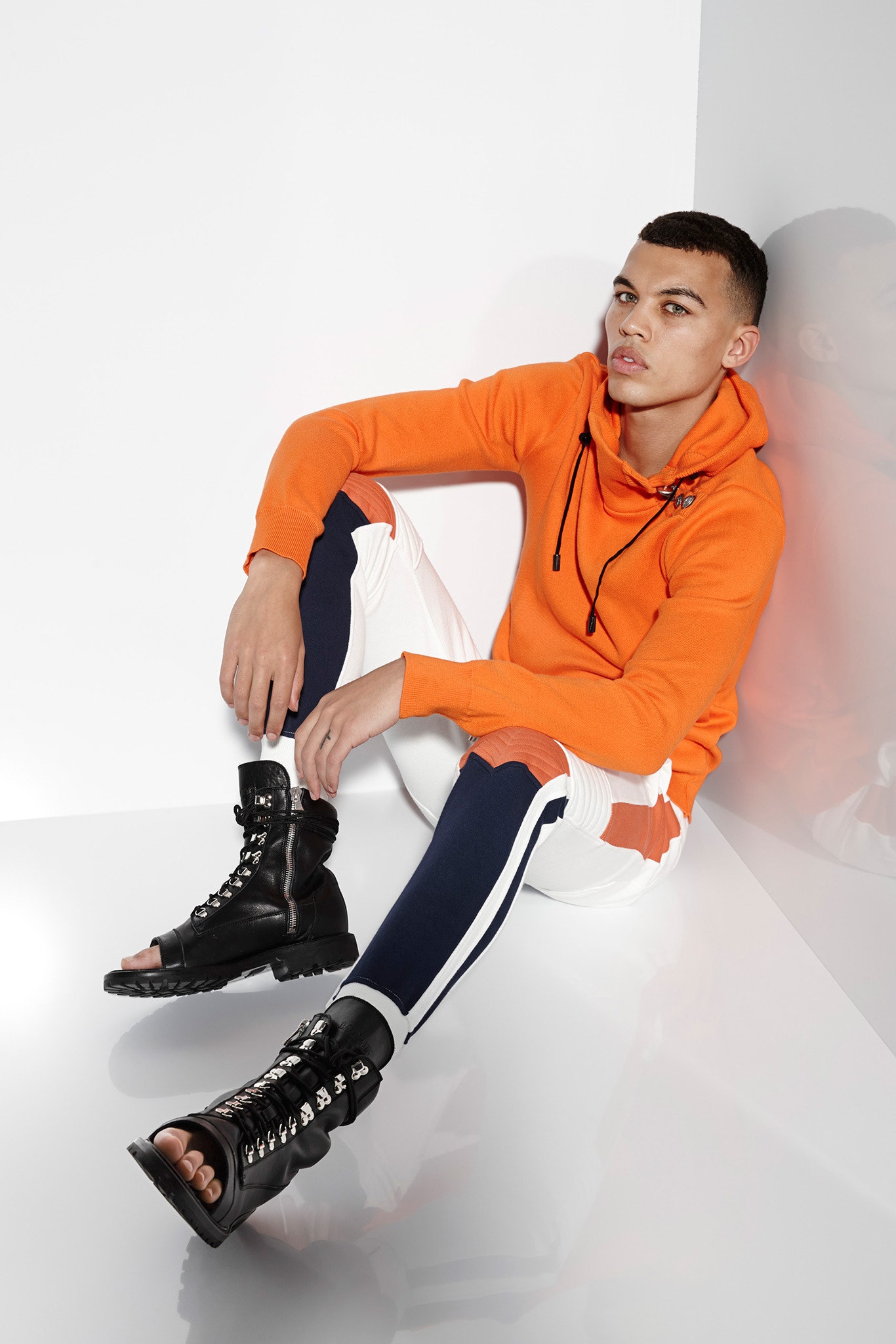 orange hoodie with color-blocked pants