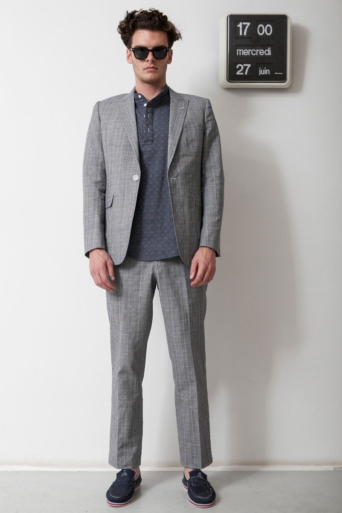gray tailored suit with blue shirt