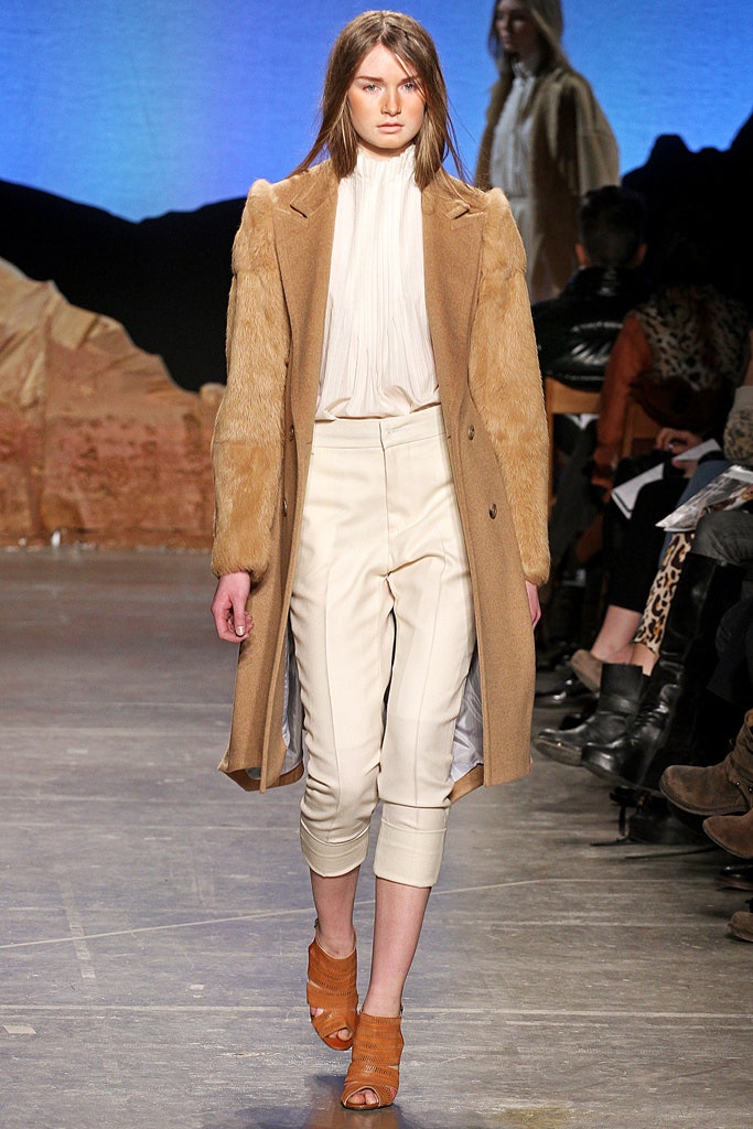 brown faux-fur coat with beige pants