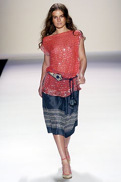 red silk sleeveless top and blue midi skirt