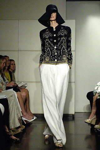 black embroidered blazer and white pants