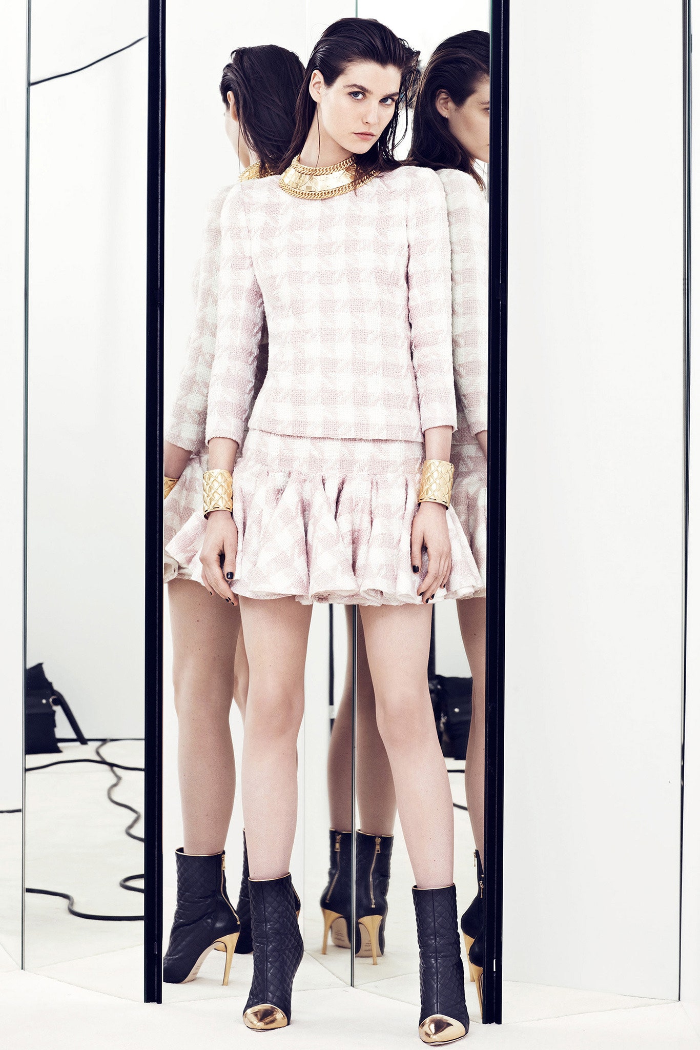 pink pleated mini dress with black boots