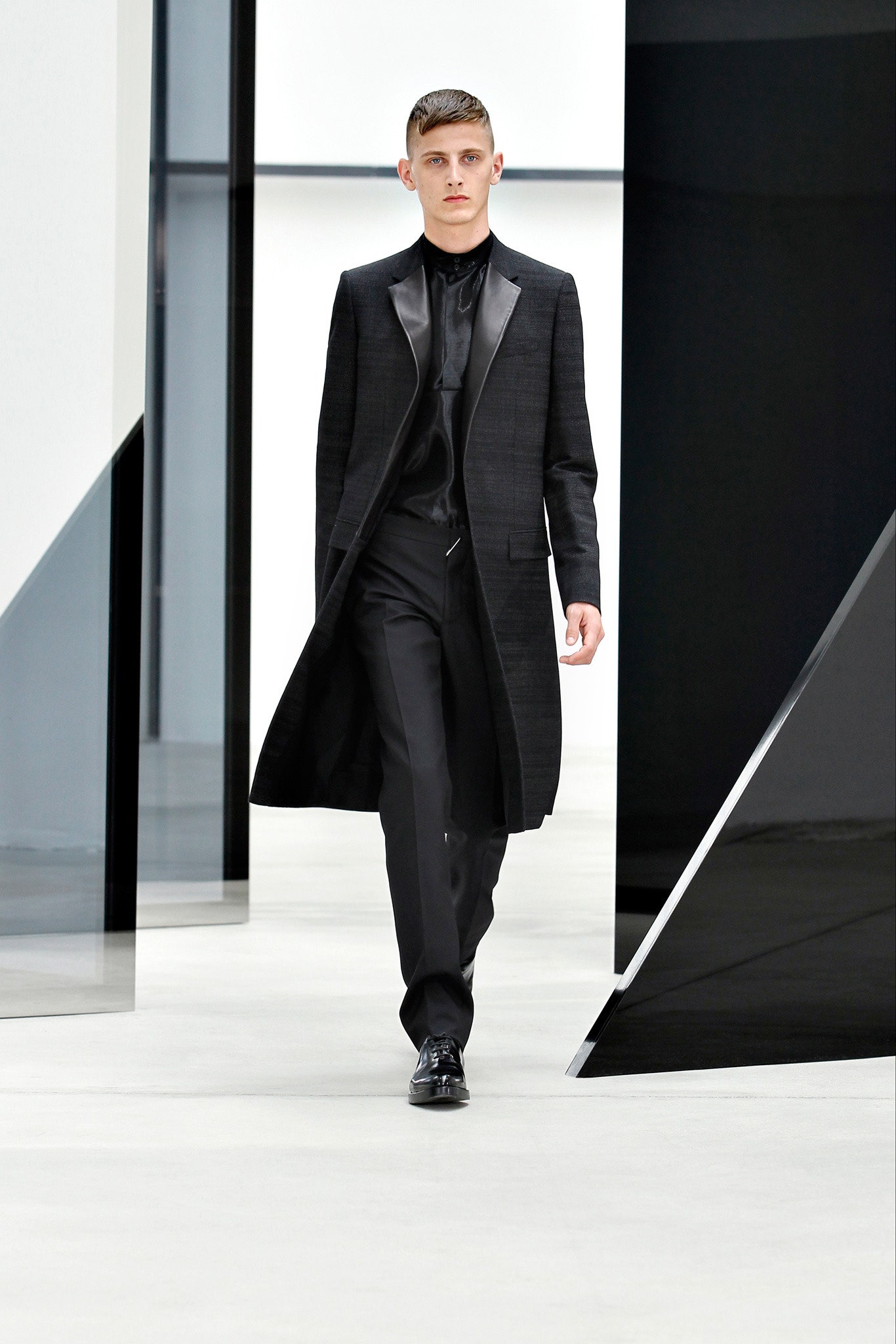 black fitted coat and tailored pants