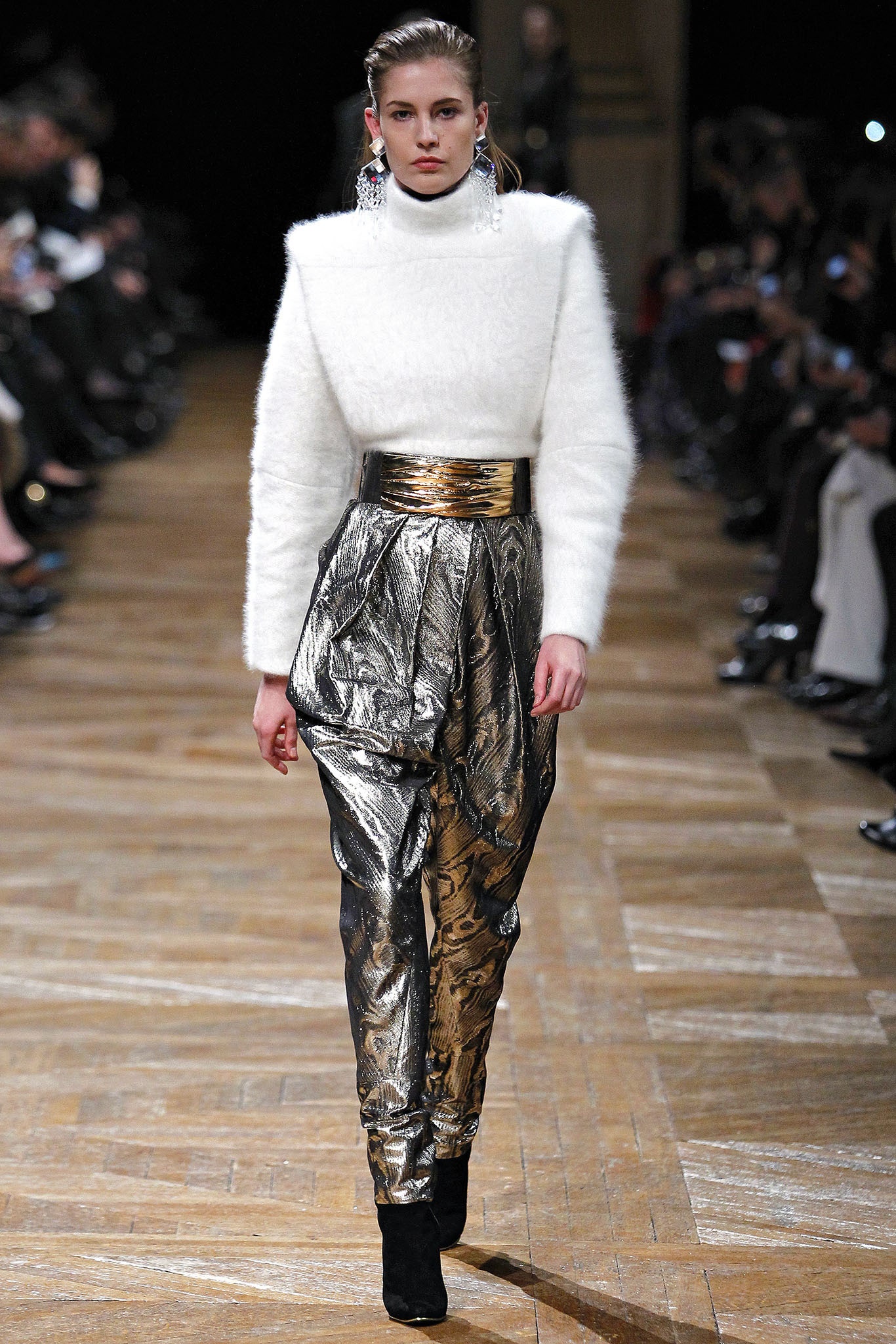 white fitted sweater and gold pleated pants