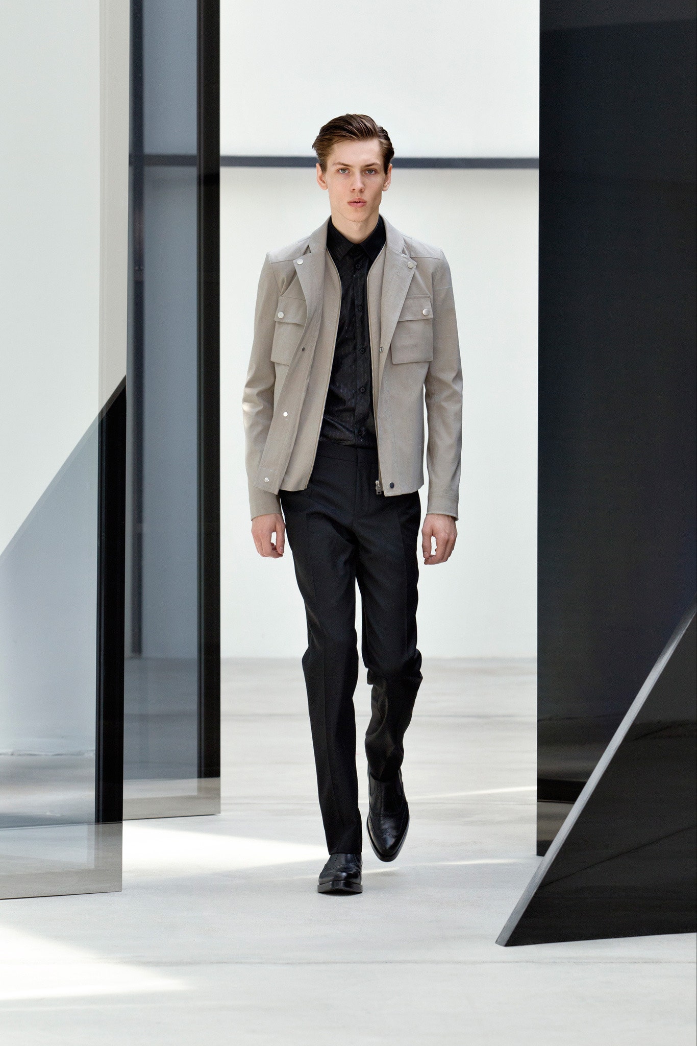 gray leather jacket and black pants