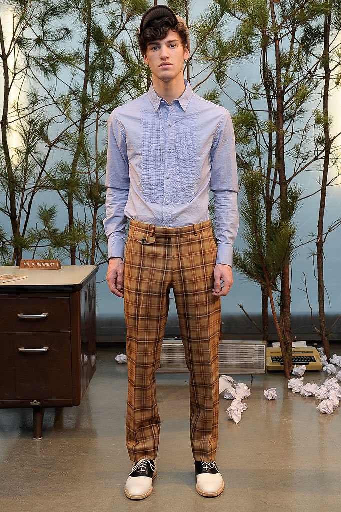 fitted blue shirt and tailored brown pants