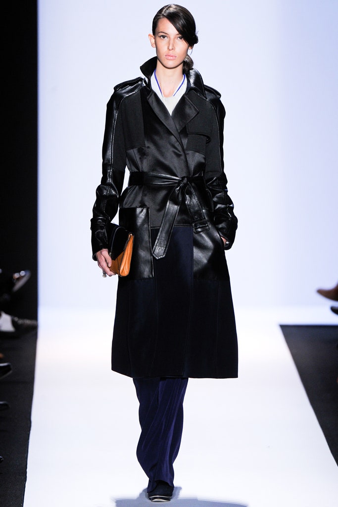 black leather fitted coat with navy pants