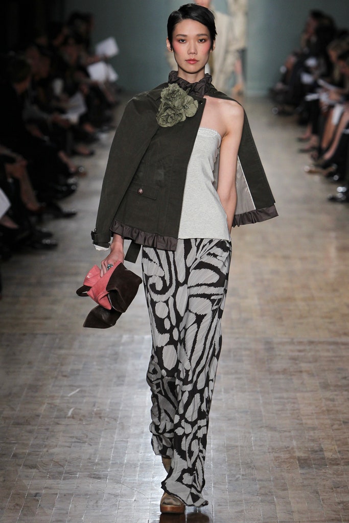 green fitted jacket gray top