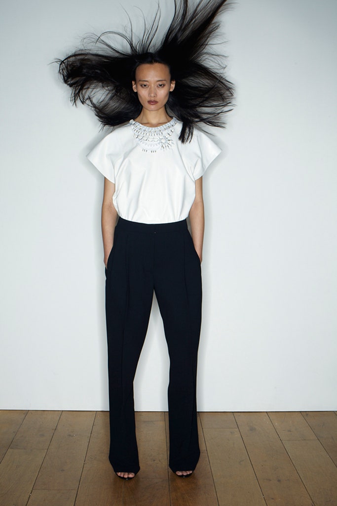 white embroidered top and black tailored pants