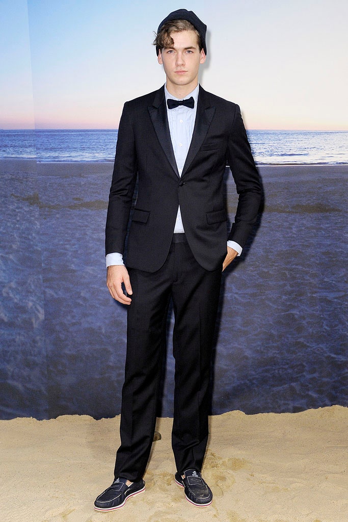 black tailored suit with blue shirt