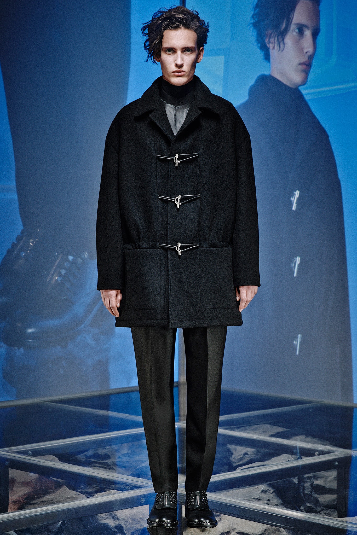 black oversized wool coat and tailored pants