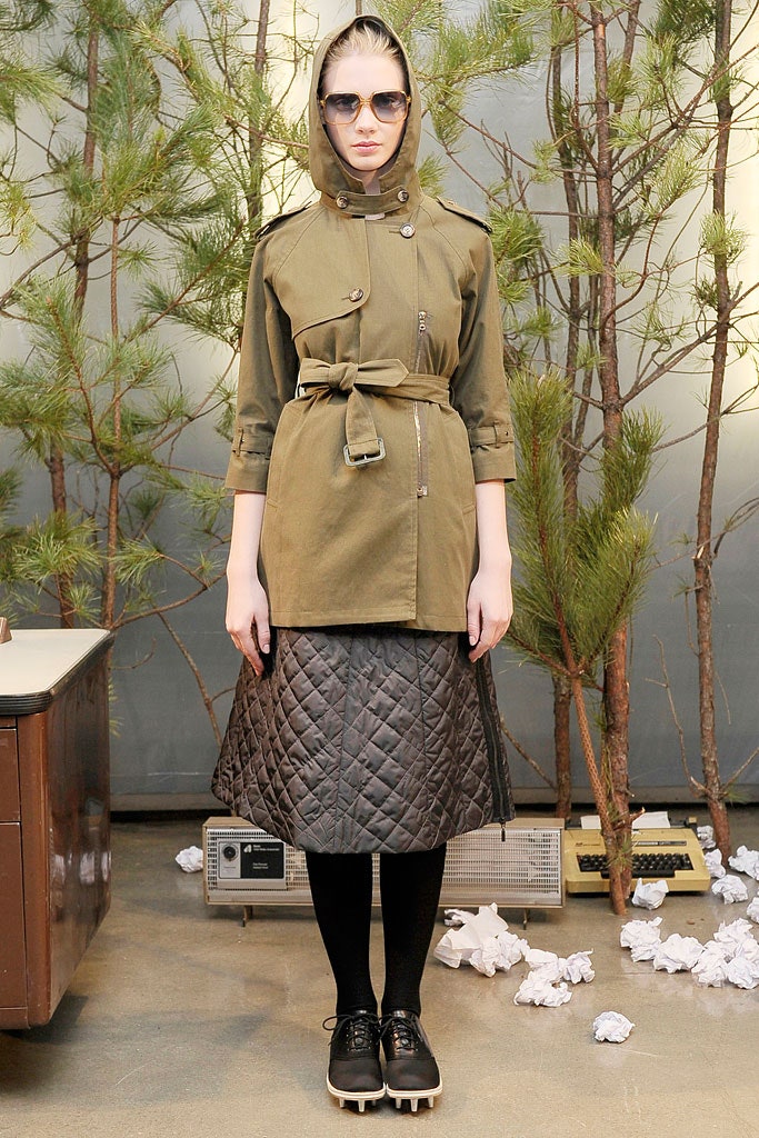green fitted jacket with brown skirt