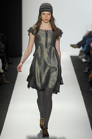 black and gold pleated dress with knit hat