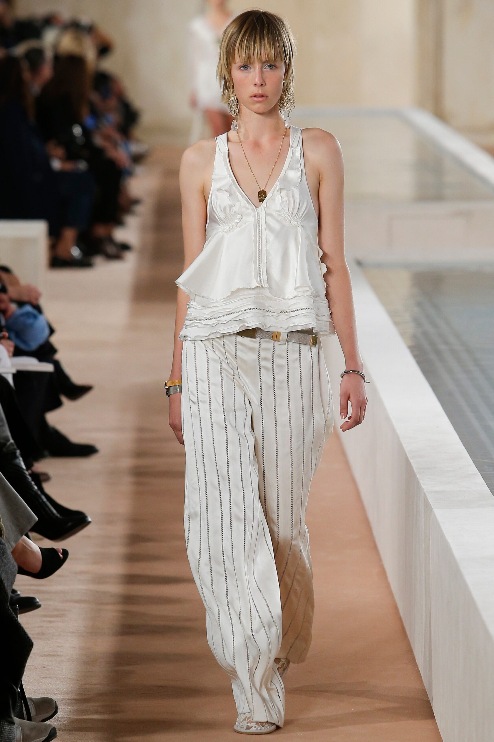 white silk sleeveless top and pants