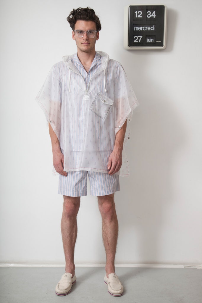 sheer white printed poncho and striped shorts