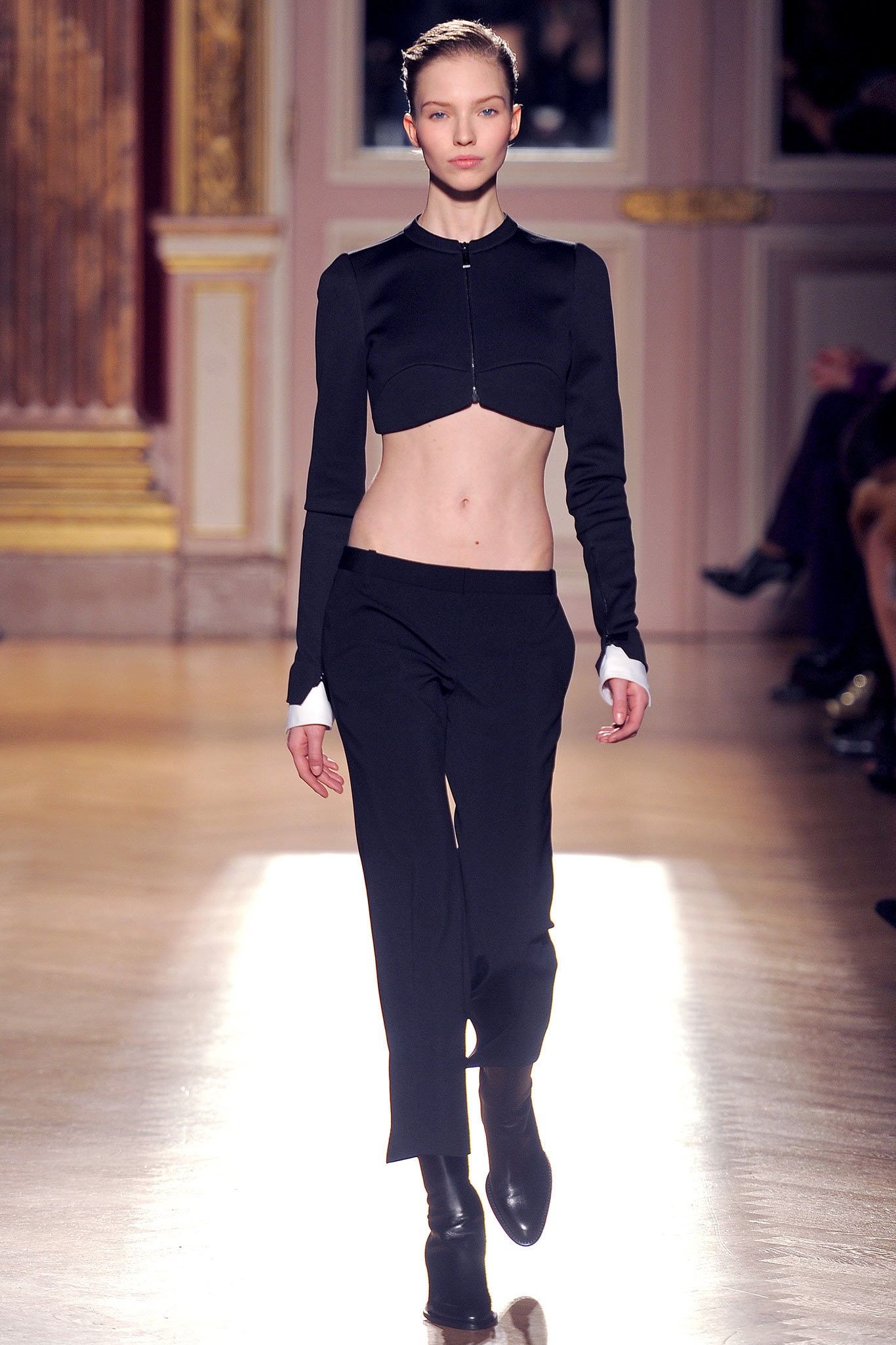 black fitted top and tailored pants