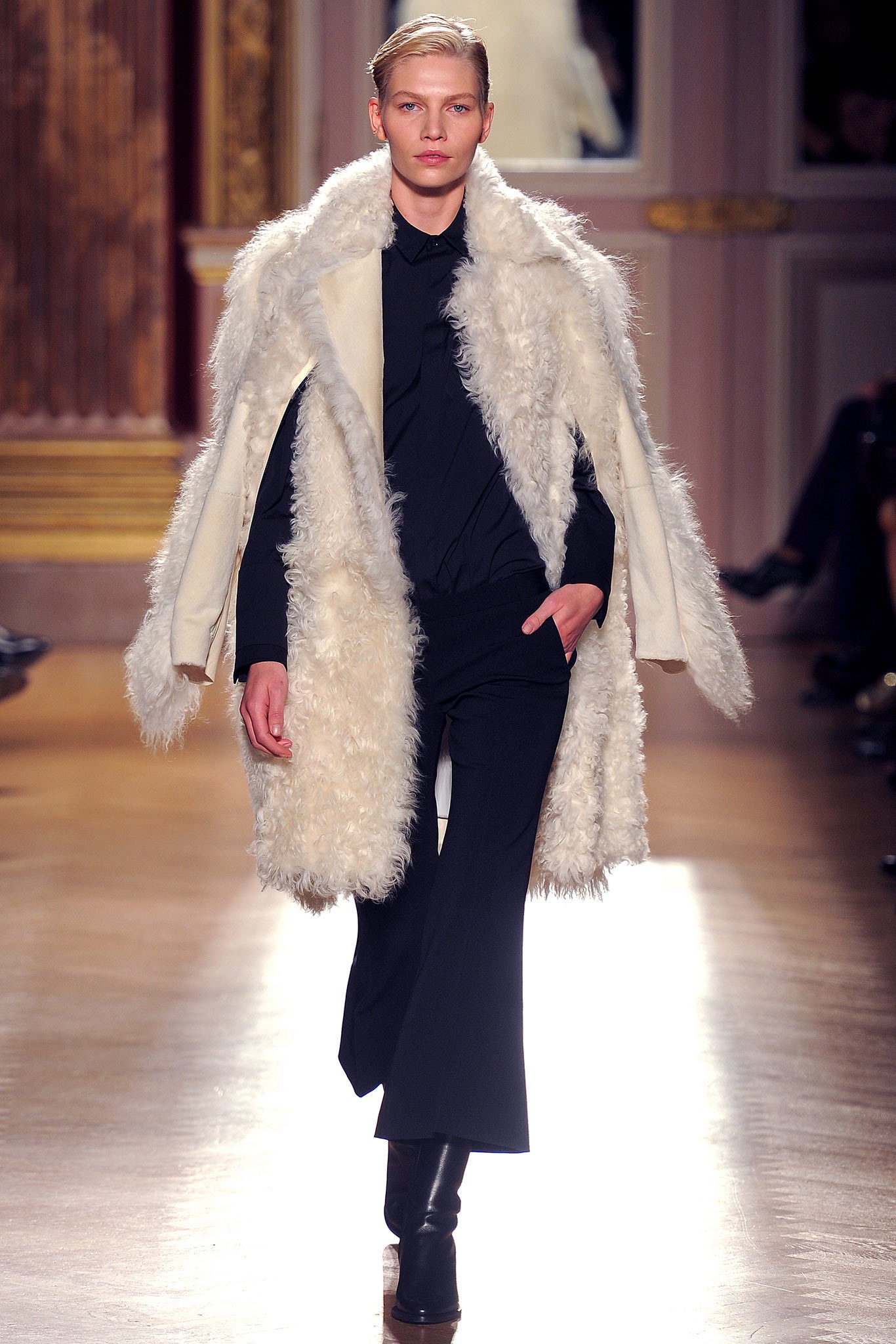 white faux-fur coat with black shirt and pants
