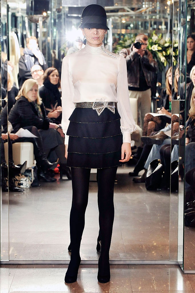 fitted white blouse and black mini skirt