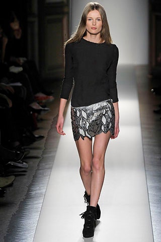 black fitted top with silver mini skirt