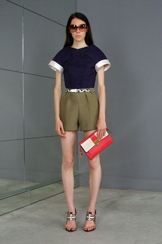 navy top and olive shorts