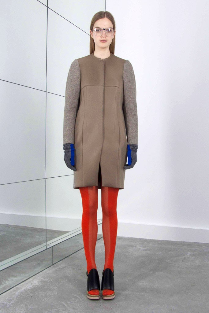 beige gray fitted coat with red pants