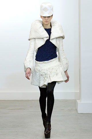white jacket blue top short skirt