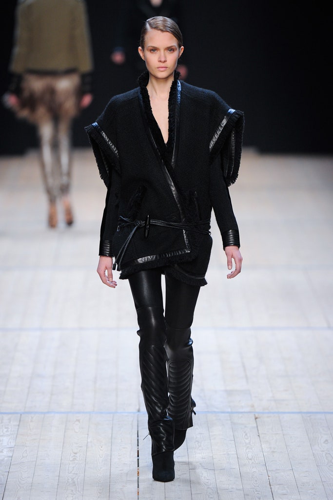 black wool poncho and leather pants