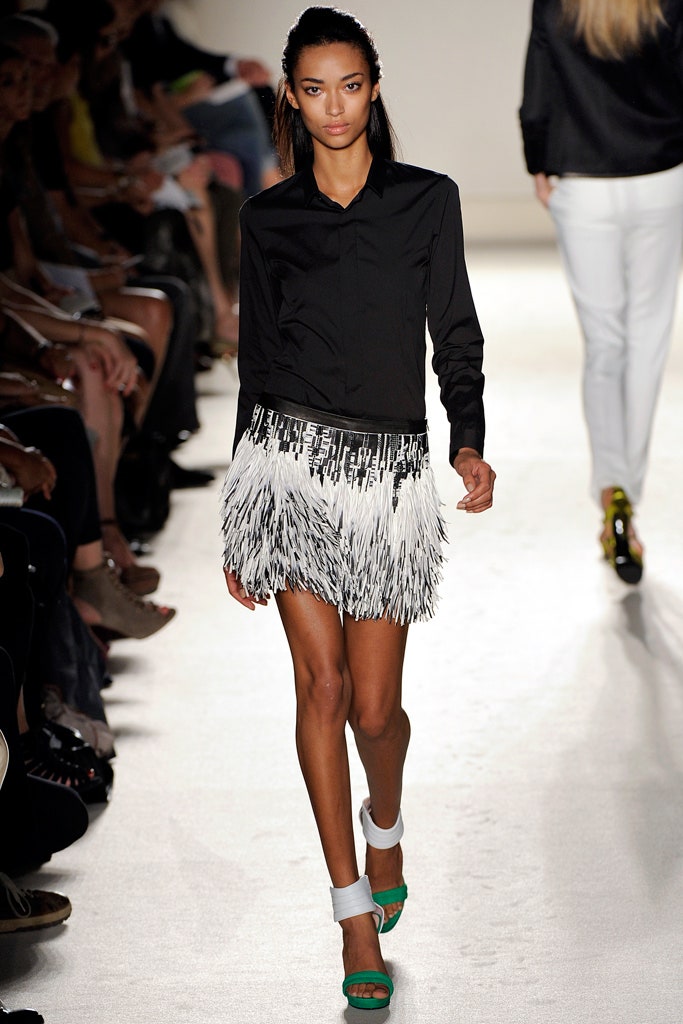 black fitted shirt with fringed mini skirt