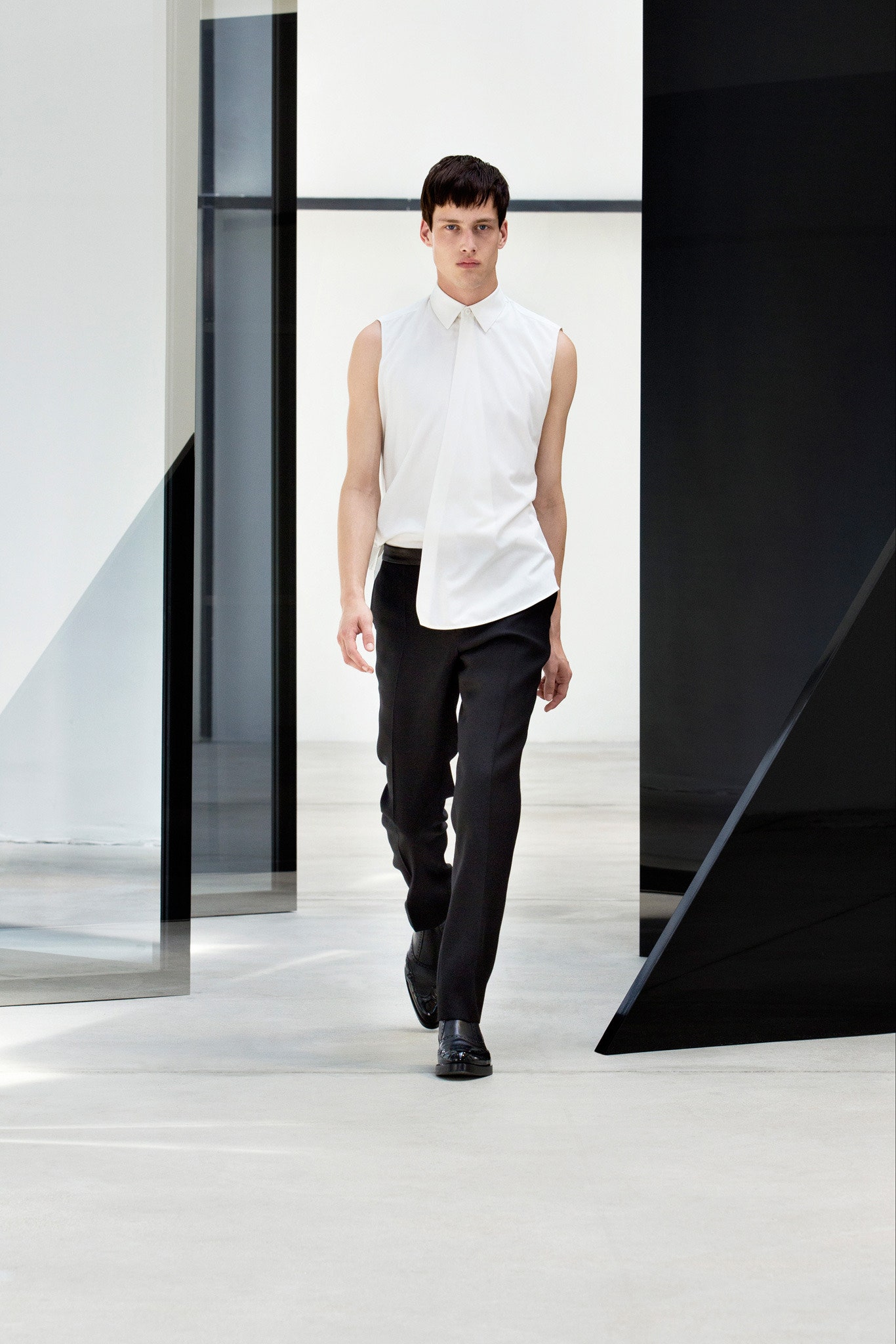 white sleeveless shirt black tailored pants