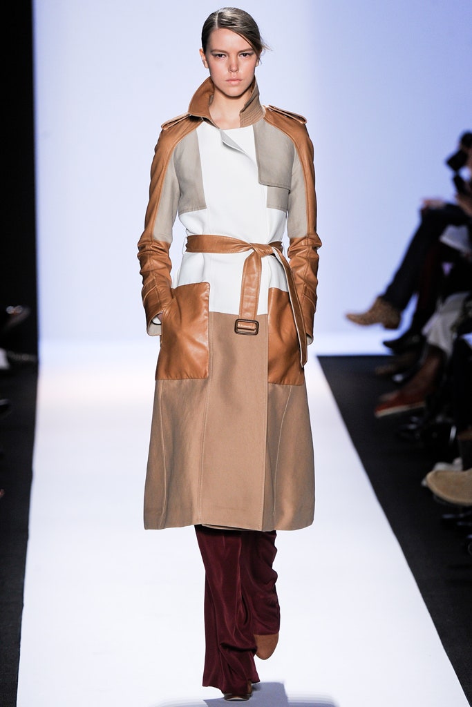 brown leather belted coat with red pants