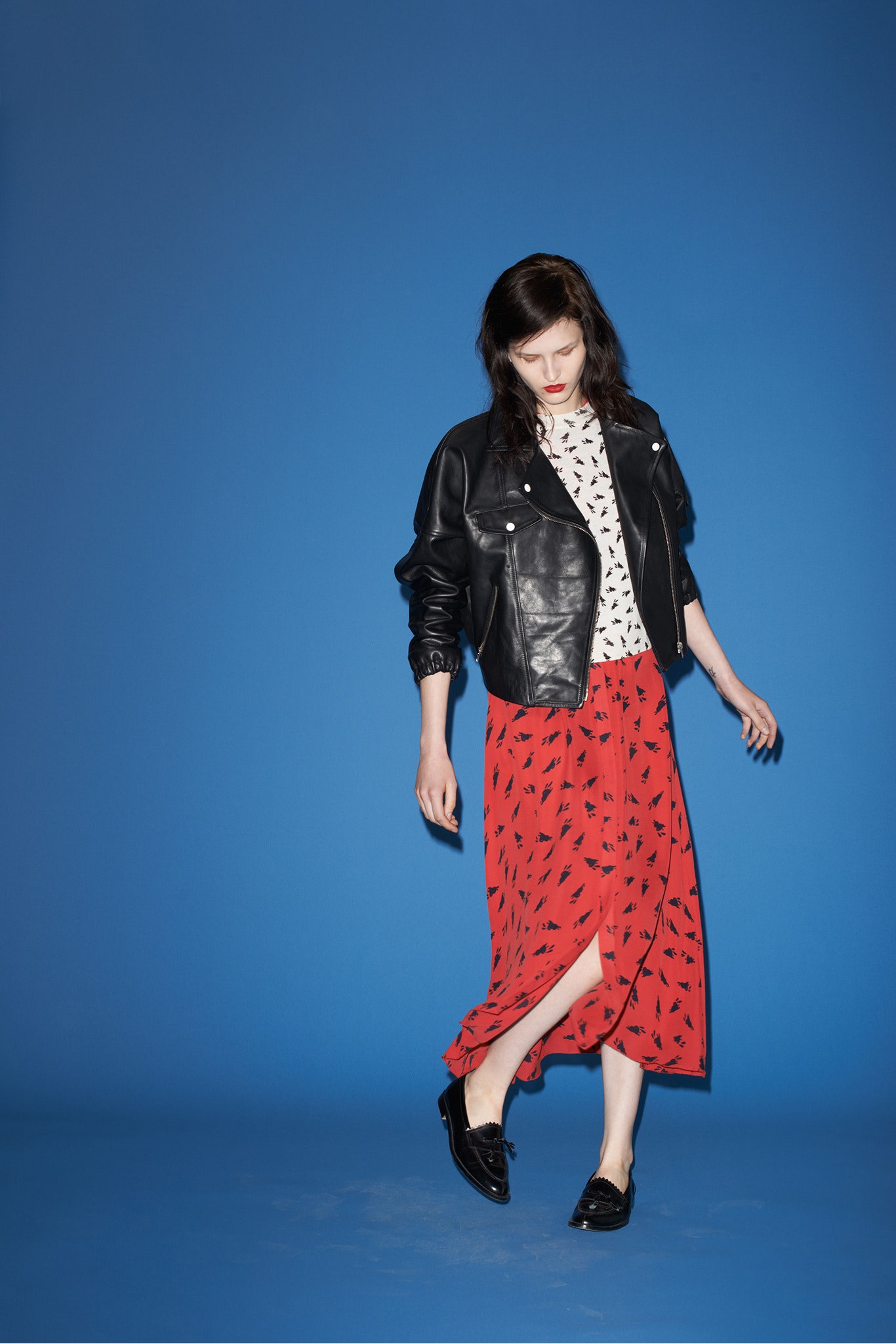 black leather jacket with red skirt