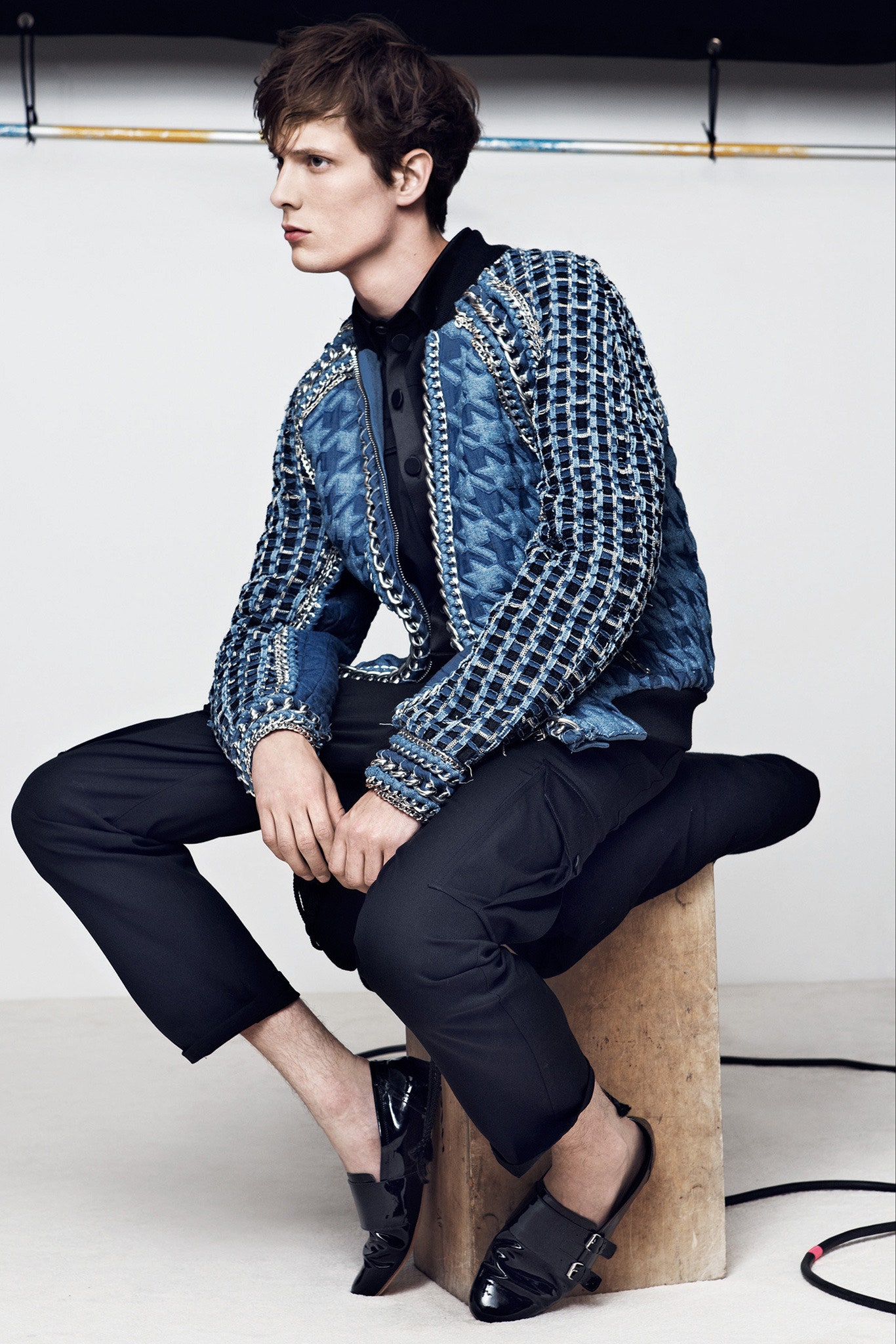 blue quilted jacket with black pants