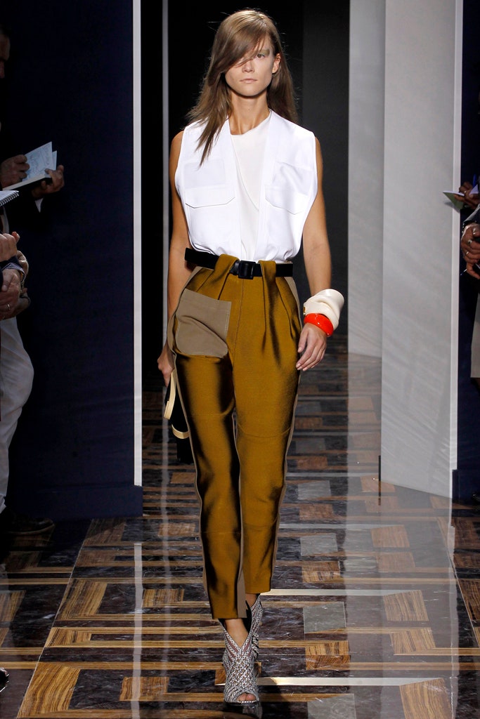 white sleeveless top with brown tailored pants