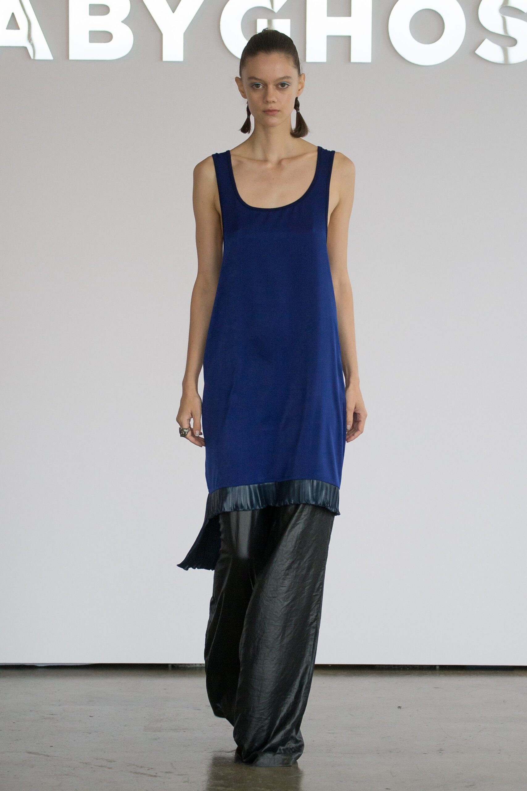 blue silk sleeveless dress with black pants
