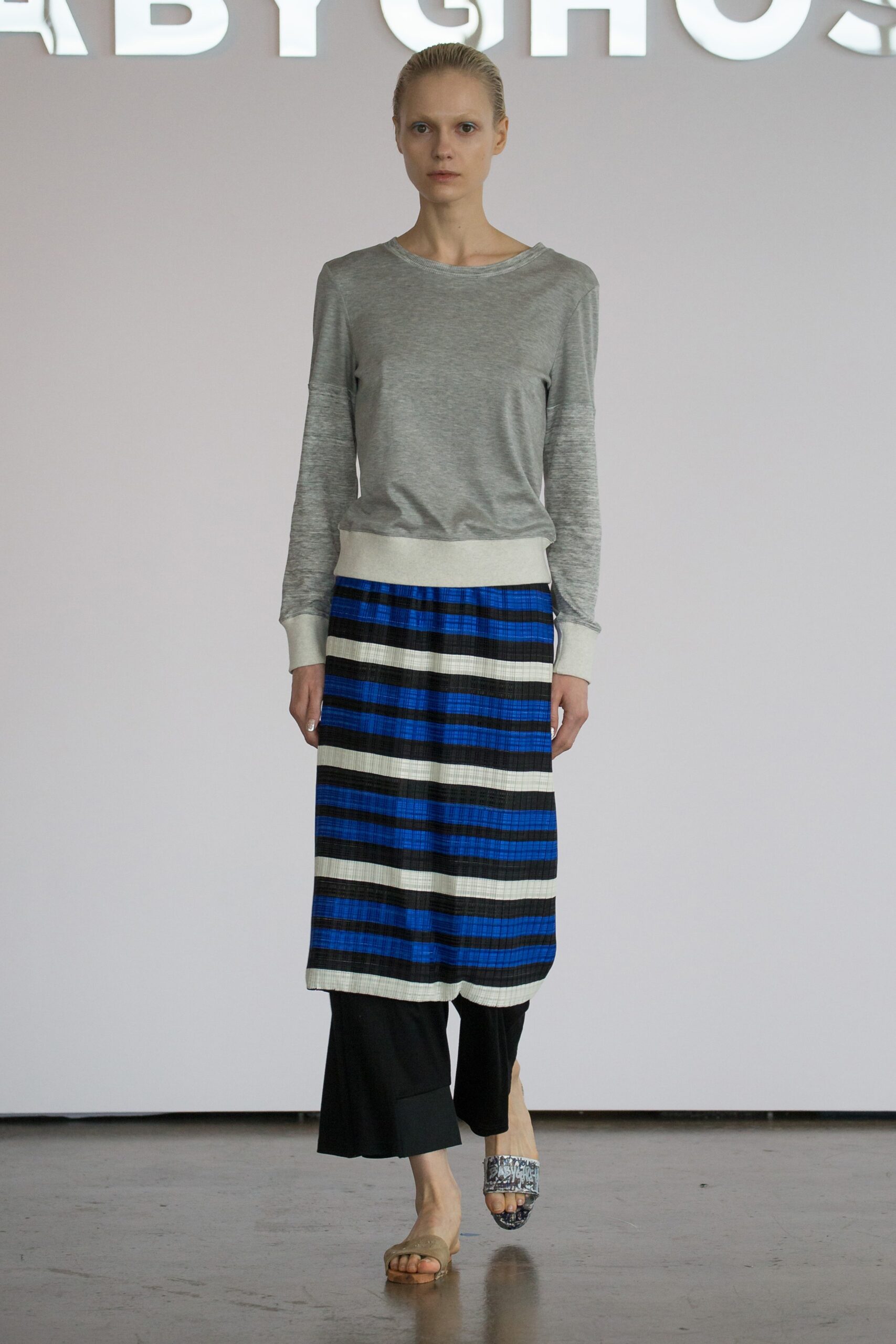gray top with striped skirt
