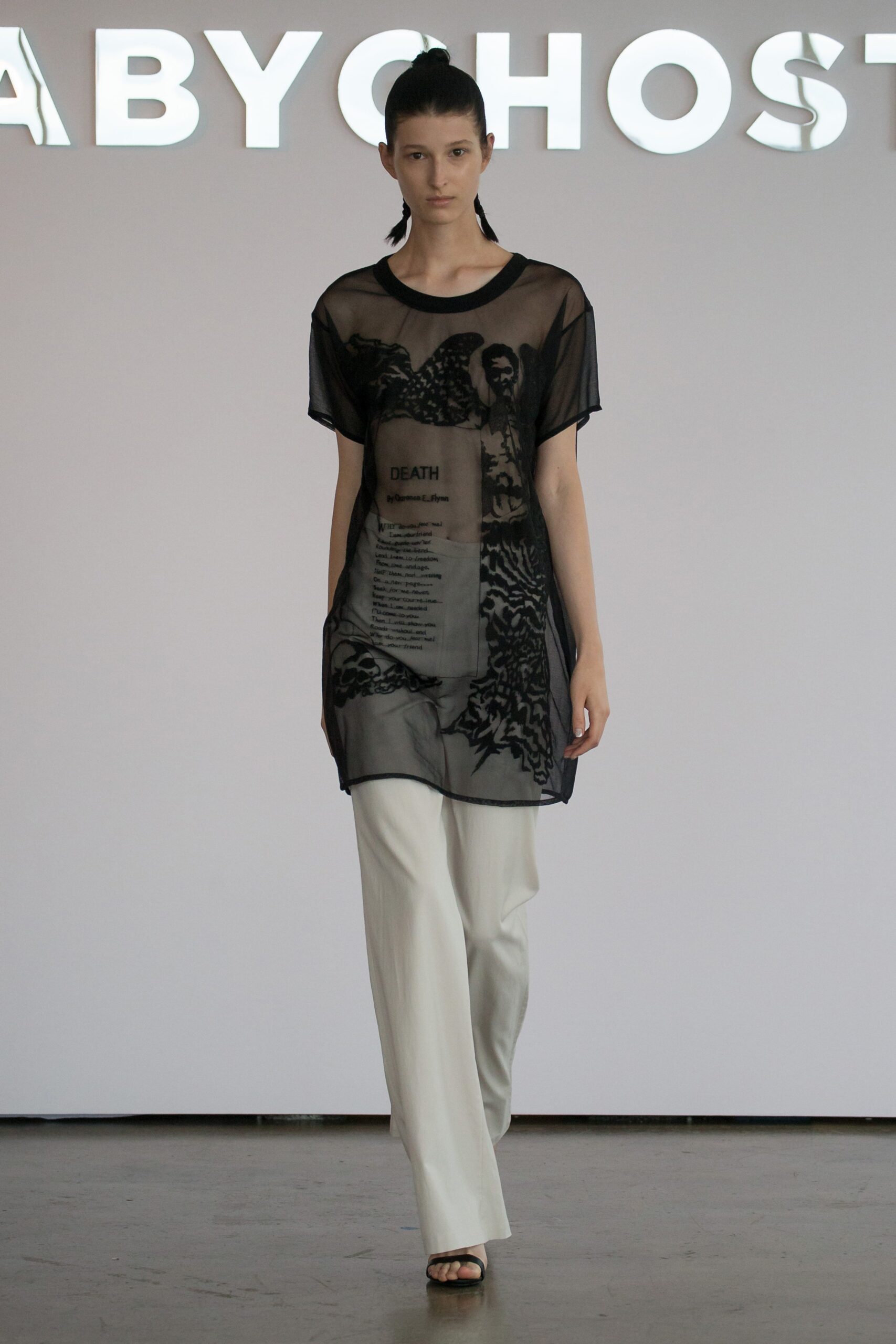 black sheer top with white pants