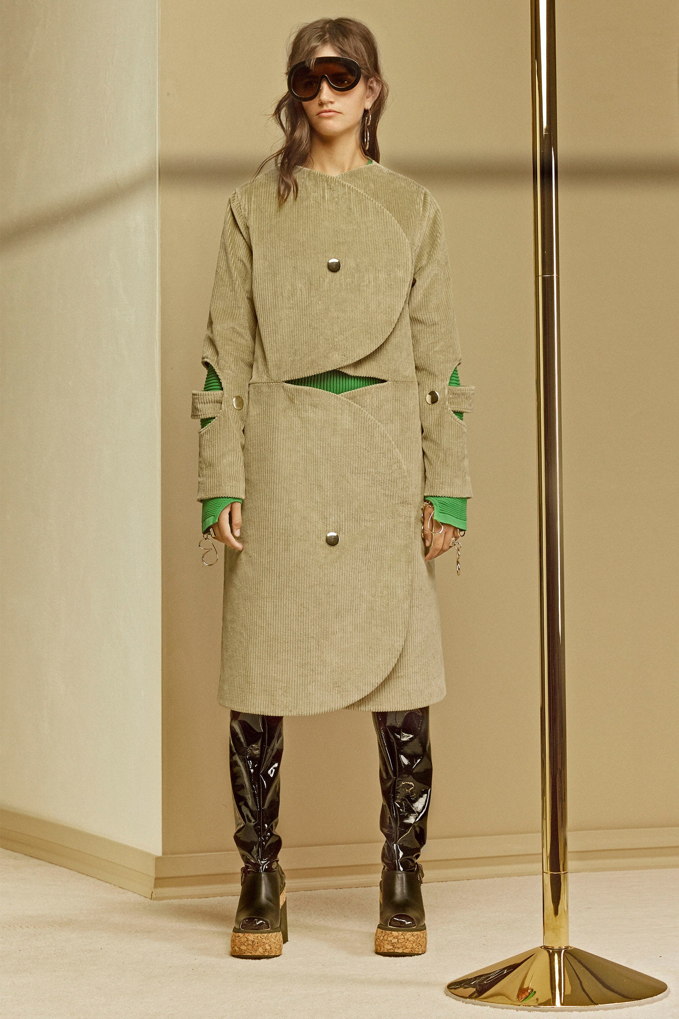 beige layered midi dress with black vinyl pants