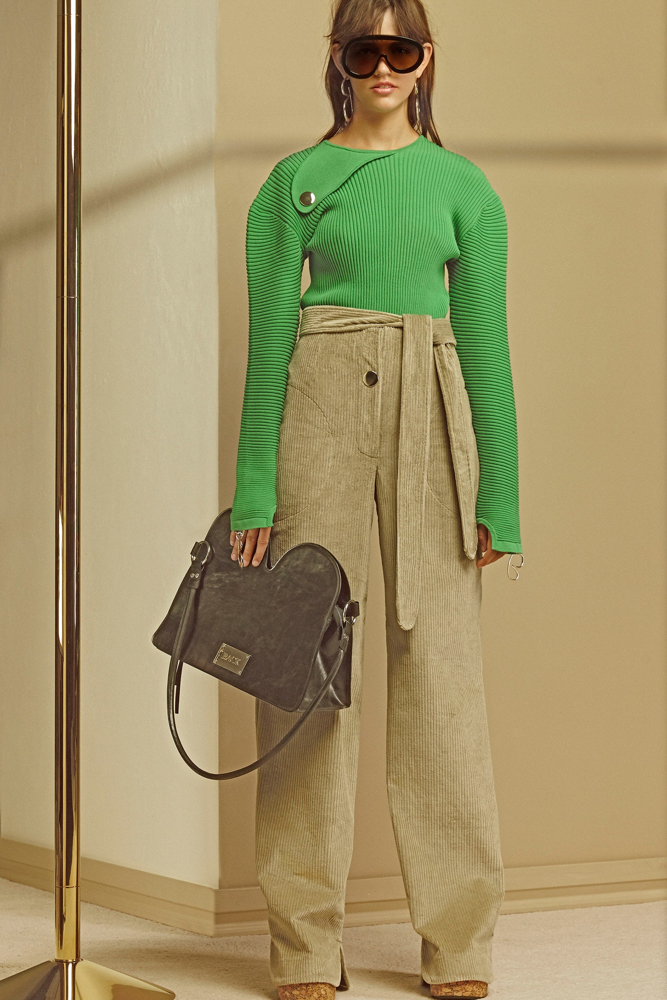 green fitted top with wide-leg pants