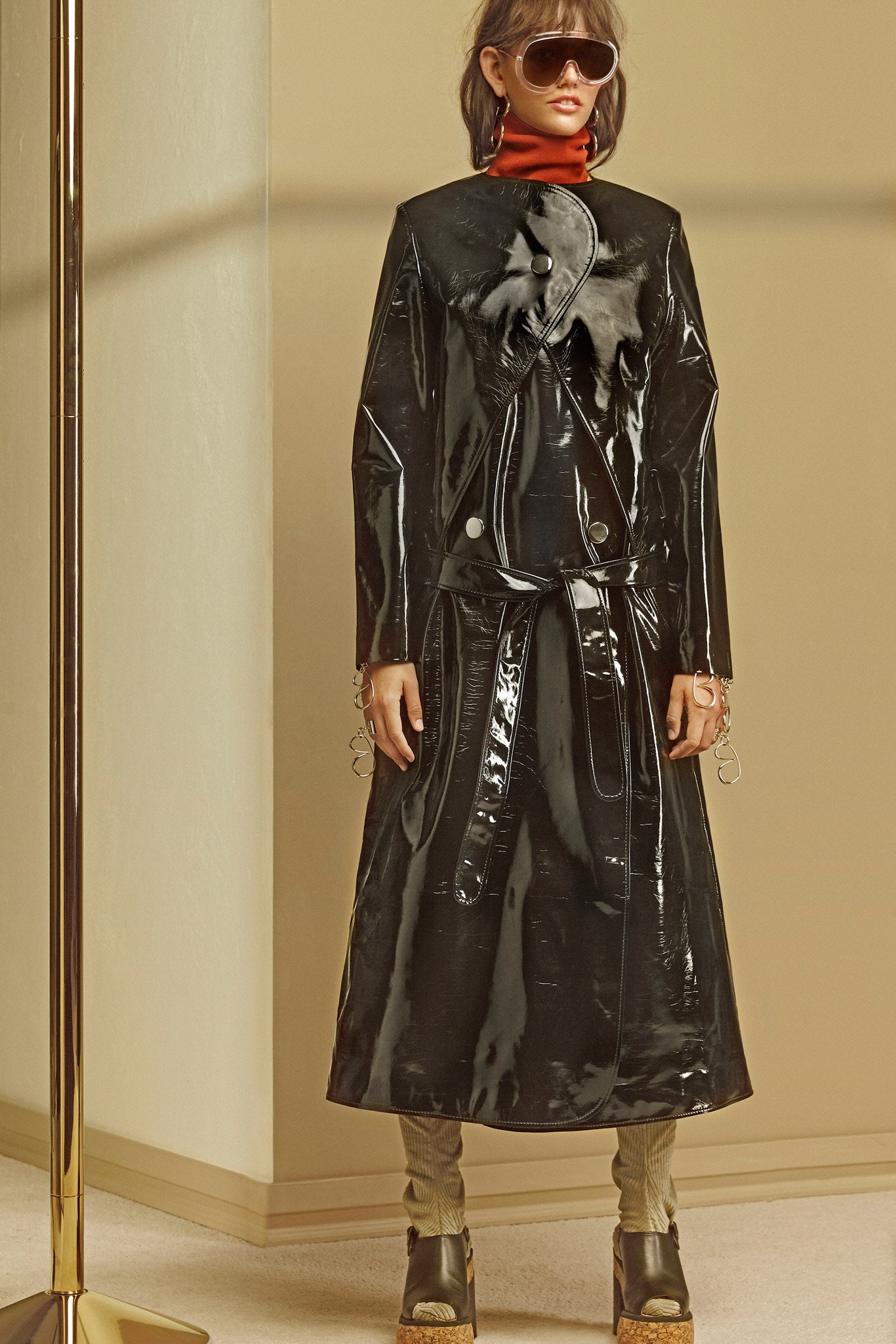 black vinyl belted coat