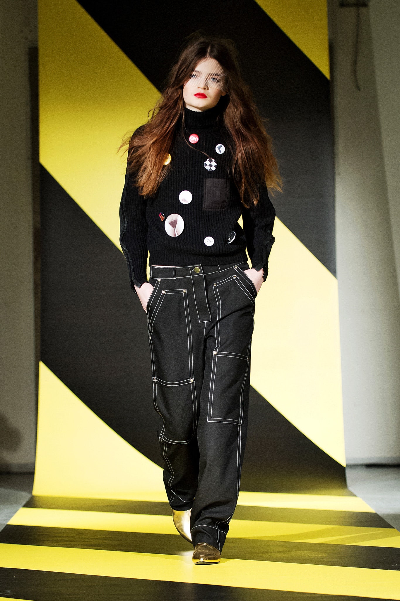 black fitted sweater and relaxed pants