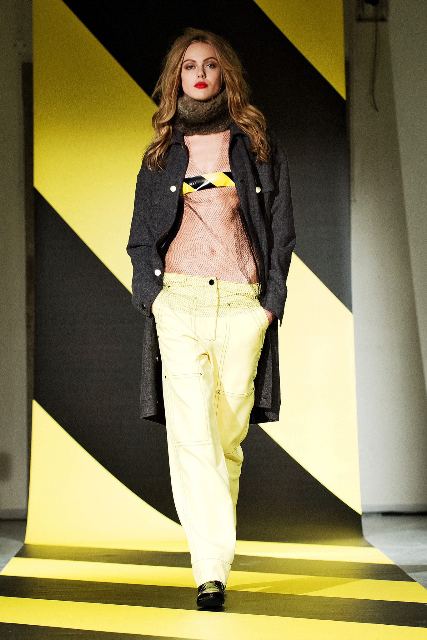 black coat yellow cargo pants