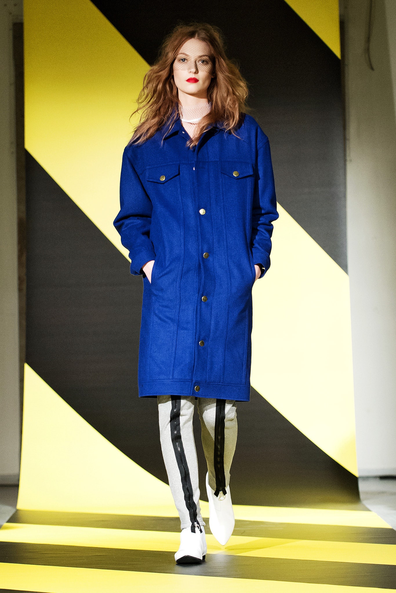 blue wool coat with gray pants