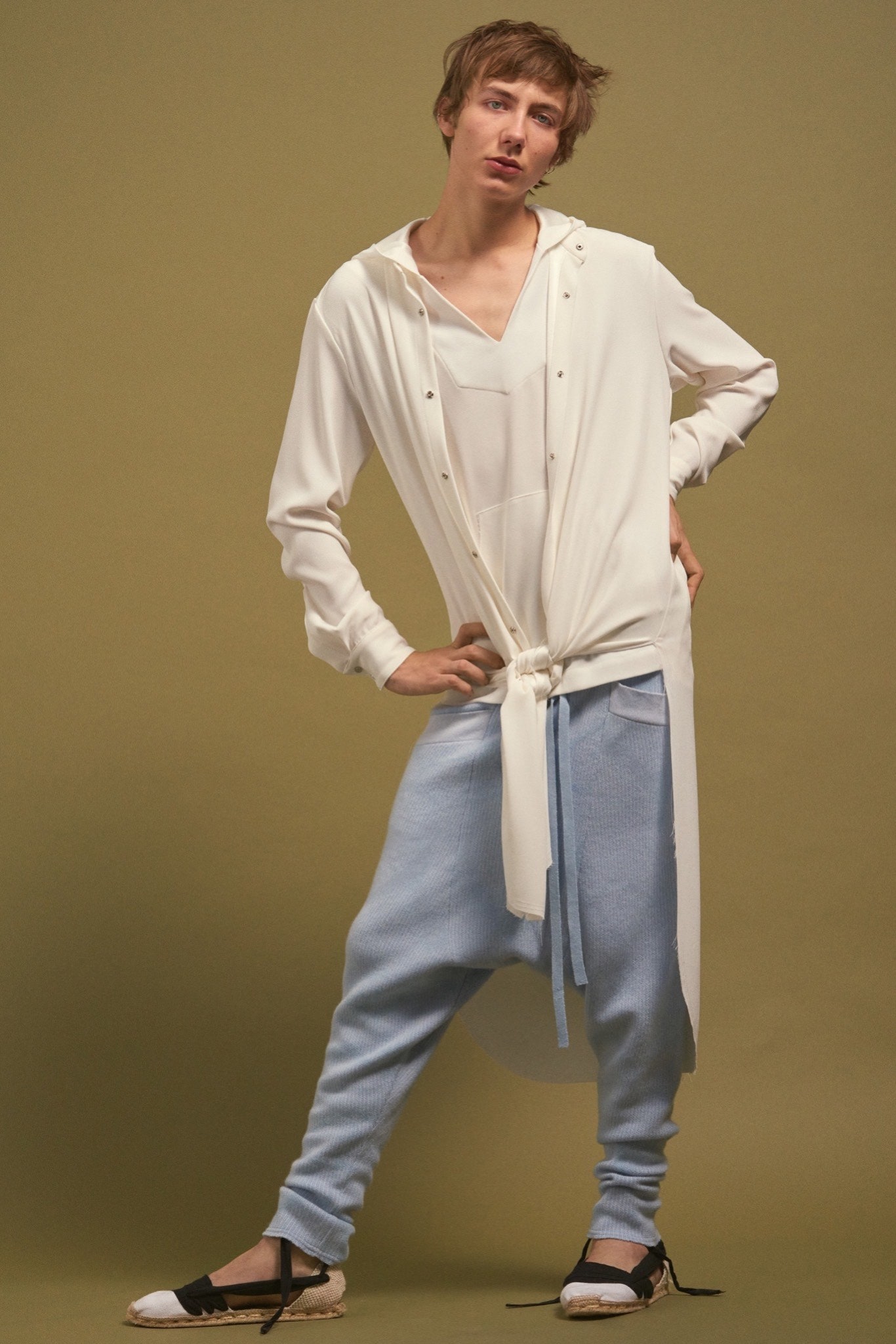 white relaxed shirt and blue pants