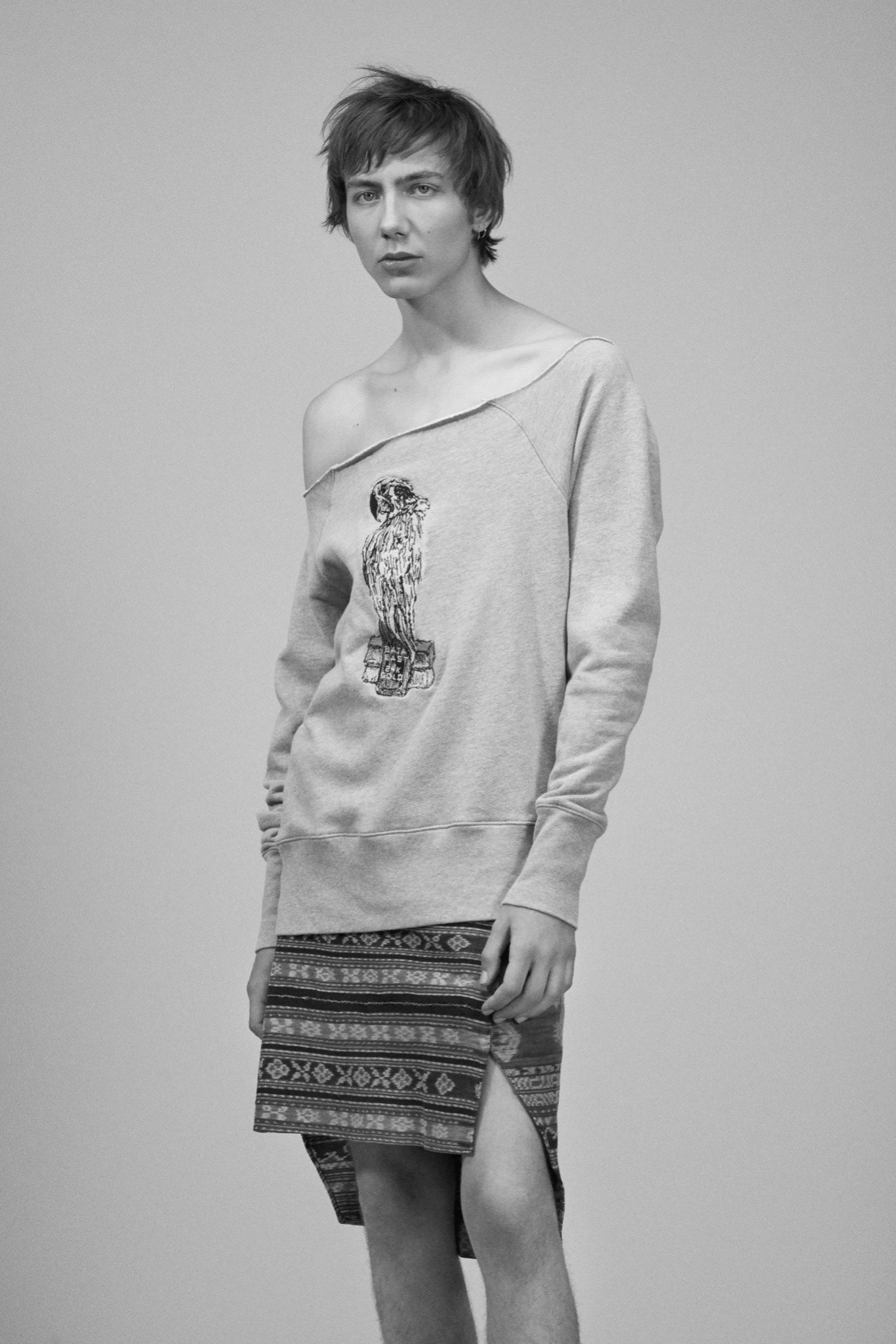 gray off-shoulder sweater with black skirt