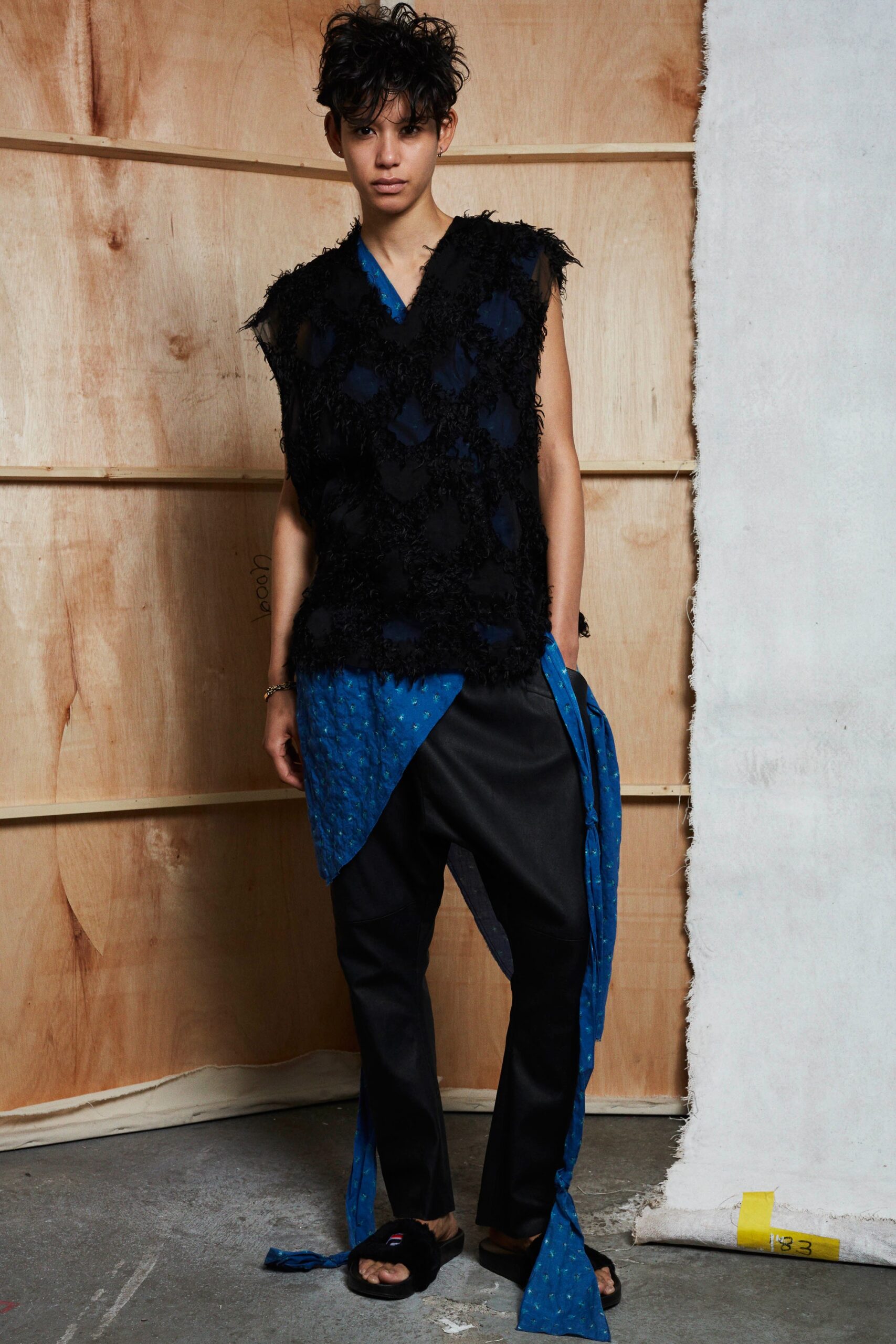 black relaxed vest with blue top