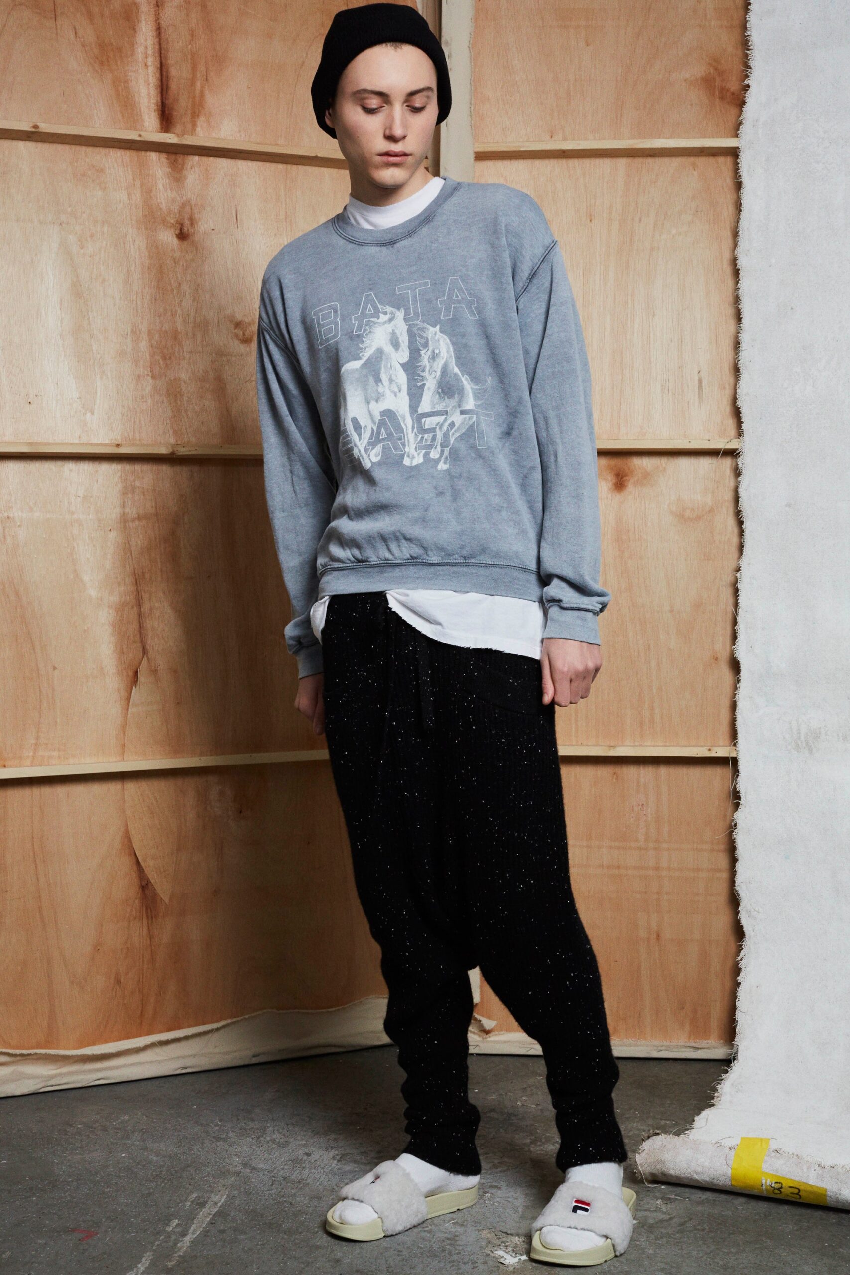 gray relaxed sweater with black pants