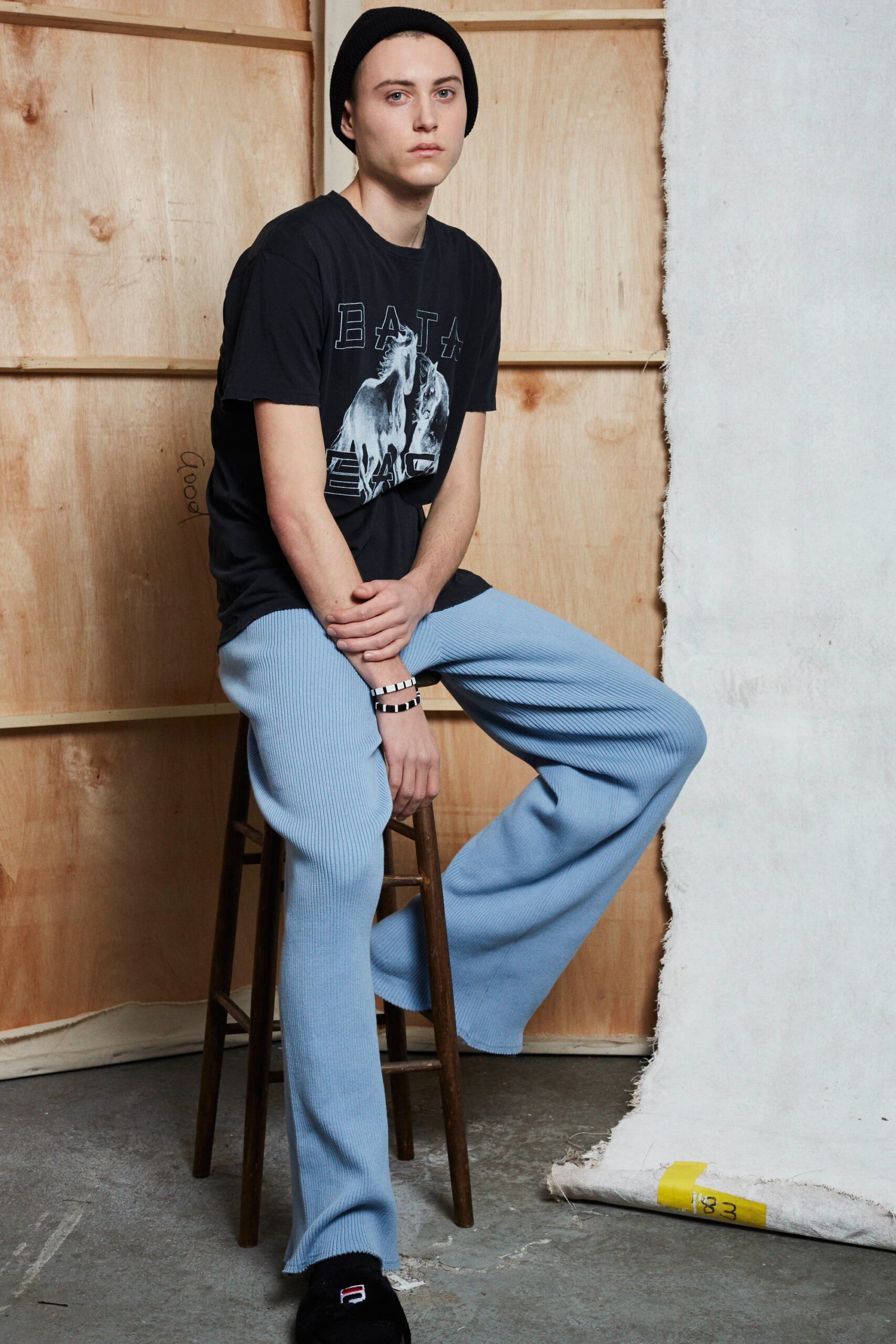 black t-shirt blue wide-leg pants