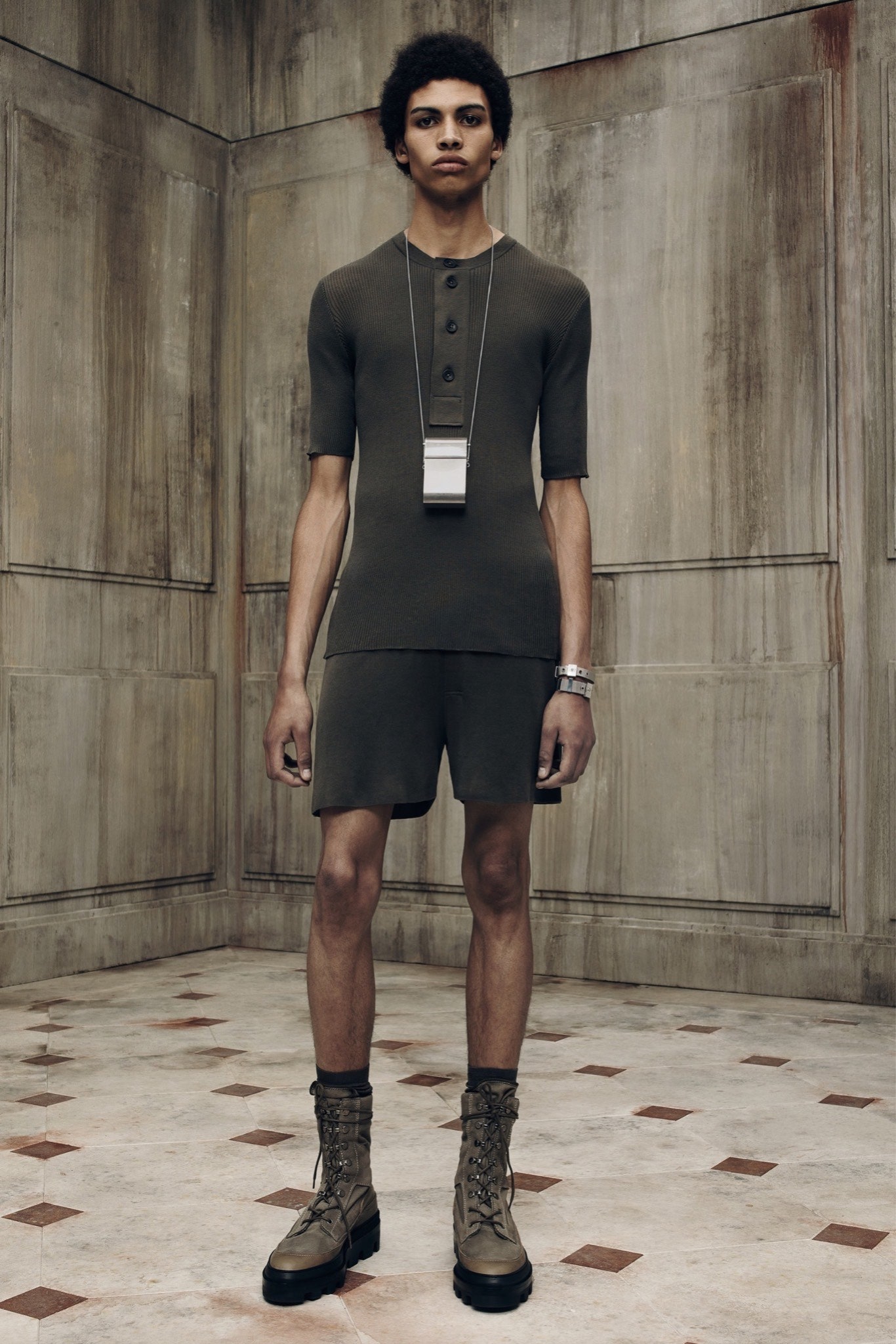 green fitted short-sleeve dress with brown boots