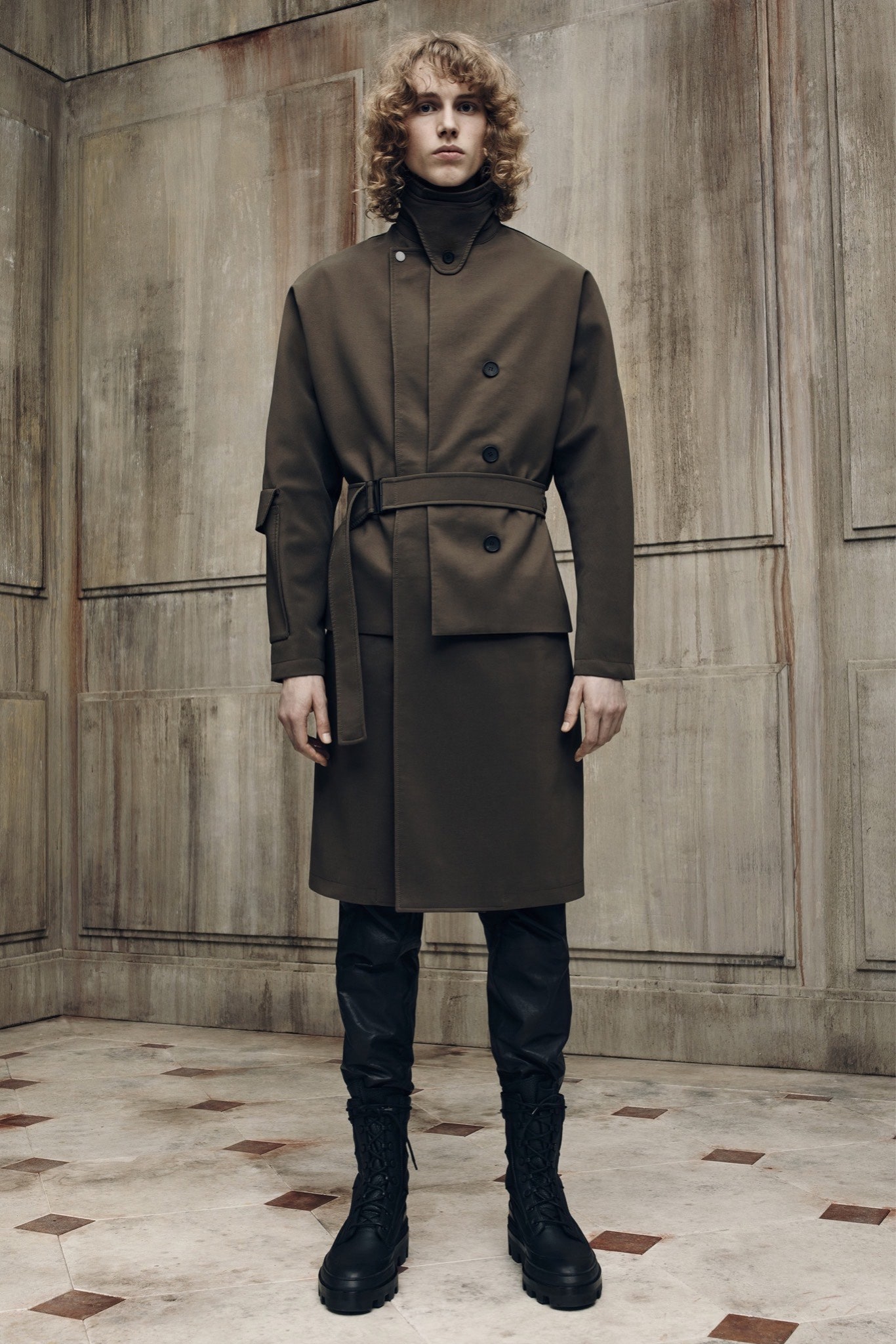 brown coat with black leather pants