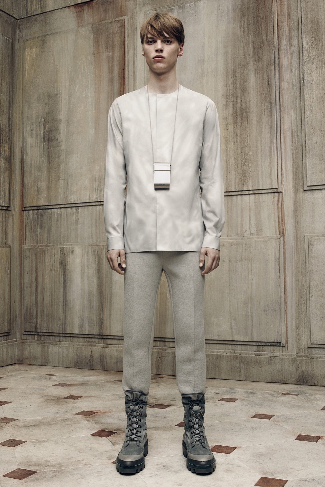 white relaxed shirt gray pants